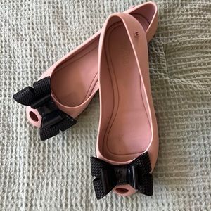 Adorable melissa flexible pale pink flats with large Black pussy bow.